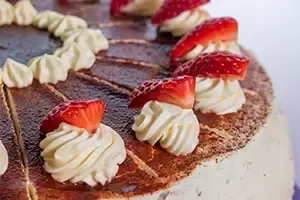Closeup view of cherries on a cake